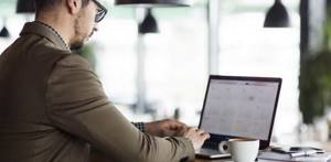 businessman looking at calendar on computer
