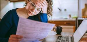 girl reading a tax statement